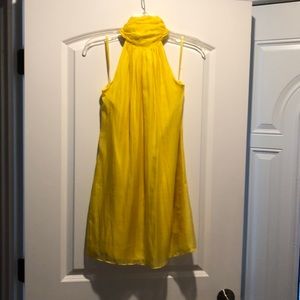 Backless dress, ties around the neck into a bow